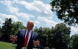 US President Donald Trump talks with reporters on the South Lawn of the White House before departing to Japan for the G-20 summit, June 26, 2019, in Washington. (AP Photo/Evan Vucci)