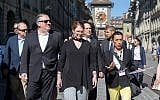 US Secretary of State Mike Pompeo, front left, and his wife Suzan, front center, listen to a tour guide during a sightseeing walk as part of Pompeo's visit in Bern, Switzerland, June 1, 2019. (Peter Klaunzer/Keystone via AP)
