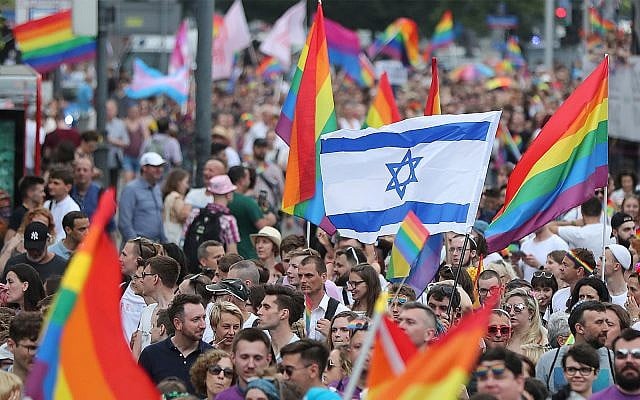 Marchers wave an Israeli flag in Warsaw's Pride Parade, June 8, 2019. (AP Photo/Czarek Sokolowski)