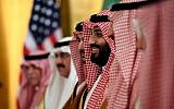 Saudi Arabia's Crown Prince Mohammed bin Salman smiles as he listens during his meeting with US President Donald Trump during a working breakfast on the sidelines of the G20 summit in Osaka, Japan, June 29, 2019. (AP Photo/Susan Walsh)