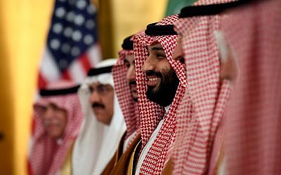 Saudi Arabia's Crown Prince Mohammed bin Salman smiles as he listens during his meeting with US President Donald Trump during a working breakfast on the sidelines of the G20 summit in Osaka, Japan, June 29, 2019. (AP Photo/Susan Walsh)