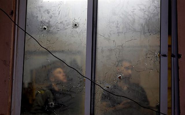 Bullet holes at the Palestinian Authority security apparatus headquarters in Nablus, a result of an accidental firefight between IDF troops and PA security personnel, June 11, 2019. (JAAFAR ASHTIYEH / AFP) Bullet holes at the Palestinian Authority security apparatus headquarters in Nablus, a result of an accidental firefight between IDF troops and PA security personnel, June 11, 2019. (JAAFAR ASHTIYEH / AFP)