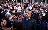 People wear kippahs during a demonstration against anti-Semitism in Berlin, April 25, 2018. (AP Photo/Markus Schreiber)