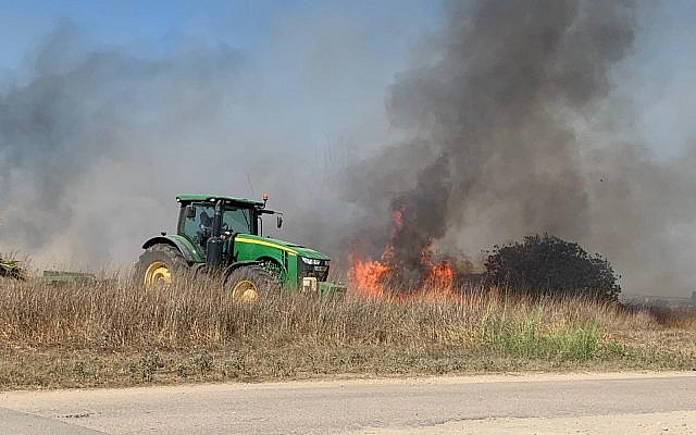 A fire caused by an incendiary device from the Gaza Strip rages in an agricultural field in the Sha'ar Hanegev region of southern Israel on June 27, 2019. (Sha'ar Hanegev regional council)