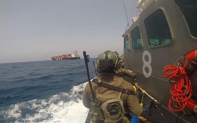 Israeli naval forces prepare to board a Turkish ship which was apparently set on fire by a Turkish stowaway as it lay off the coast of Israel, June 9, 2019. (Israel Defense Forces) Israeli naval forces prepare to board a Turkish ship which was apparently set on fire by a Turkish stowaway as it lay off the coast of Israel, June 9, 2019. (Israel Defense Forces)