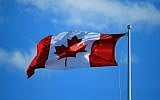 A Canadian flag flies in the wind  in Toronto, Ontario, Canada, on July 25, 2016.  (Vaughn Ridley/Getty Images/JTA)