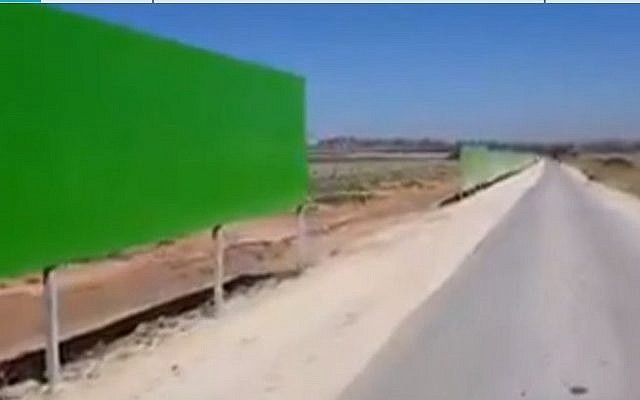A section of the new protective barrier erected on roads bordering Gaza to protect Israeli drivers and farmers from bullets and missiles. (Channel 12 screen capture) A section of the new protective barrier erected on roads bordering Gaza to protect Israeli drivers and farmers from bullets and missiles. (Channel 12 screen capture)