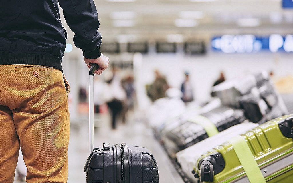 Illustrative image of a man at an airport/travel (Chalabala; iStock by Getty Images)