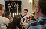 Rabbi Dawid Szychowski telling journalists about the Festival of Tranquility that he launched in Lodz, Poland, on June 8, 2019. (Courtesy Shvei Israel/via JTA)