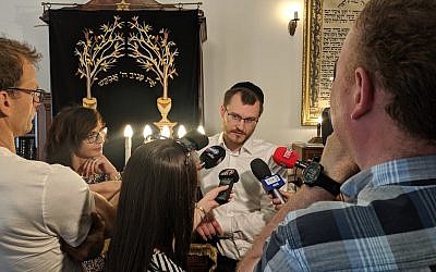 Rabbi Dawid Szychowski telling journalists about the Festival of Tranquility that he launched in Lodz, Poland, on June 8, 2019. (Courtesy Shvei Israel/via JTA)