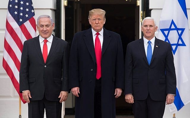 US President Donald Trump is flanked by Israeli Prime Minister Benjamin Netanyahu, left, and US Vice President Mike Pence in Washington, March 25, 2019. (Michael Reynolds – Pool/Getty Images via JTA) US President Donald Trump is flanked by Israeli Prime Minister Benjamin Netanyahu, left, and US Vice President Mike Pence in Washington, March 25, 2019. (Michael Reynolds – Pool/Getty Images via JTA)