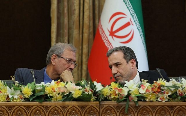 A handout picture provided by the Iranian presidency on July 7, 2019 shows (L to R) Iran's government spokesman Ali Rabiei and Deputy Foreign Minister Abbas Araghchi speaking to each other during a joint press conference at the presidential headquarters in the capital Tehran on July 7, 2019. )Iranian Presidency / AFP) A handout picture provided by the Iranian presidency on July 7, 2019 shows (L to R) Iran's government spokesman Ali Rabiei and Deputy Foreign Minister Abbas Araghchi speaking to each other during a joint press conference at the presidential headquarters in the capital Tehran on July 7, 2019. )Iranian Presidency / AFP)
