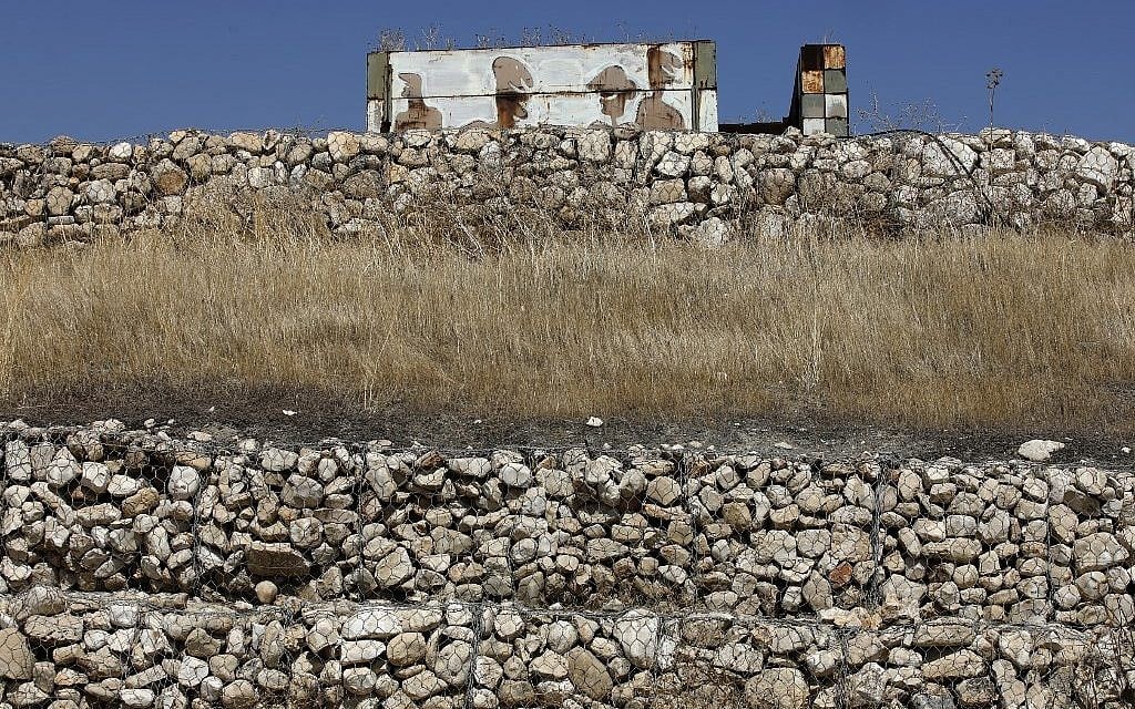 A picture taken on July 4, 2019 shows an abandoned Israeli army outpost next to the Jordan River in the West Bank. (Photo by MENAHEM KAHANA / AFP)