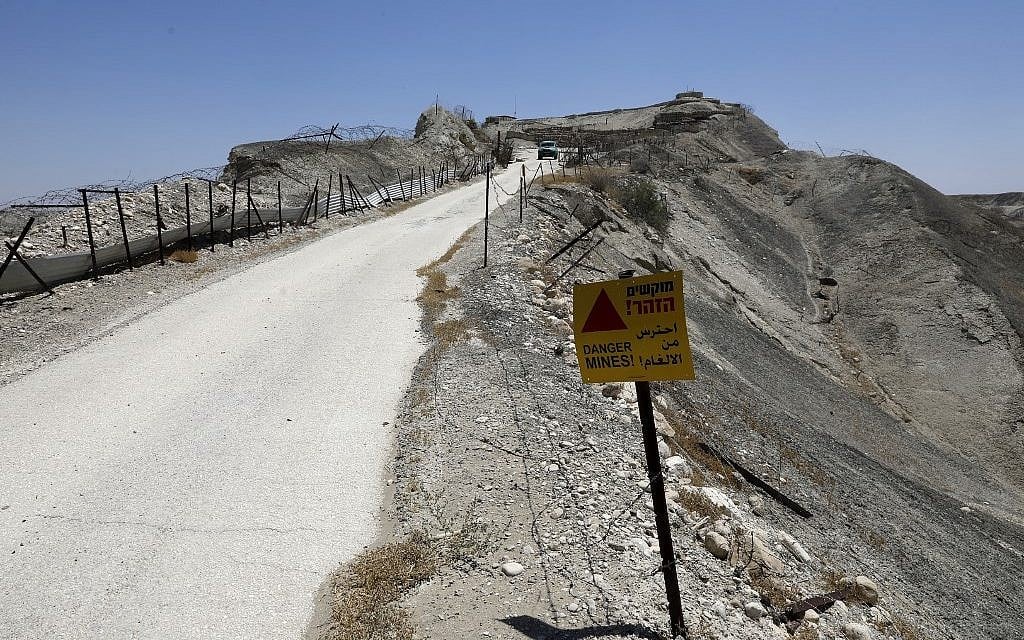 A picture taken on July 4, 2019 shows an abandoned Israeli army outpost next to the Jordan River in the West Bank. (Photo by MENAHEM KAHANA / AFP)
