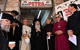 Greek Orthodox Patriarch of Jerusalem Theophilus III, center, together with the Franciscan Custodian of the Holy Land Fr Francesco Patton, center-right, and fellow church leaders from different denominations hold an ecumenical prayer outside the Petra hostel at Jaffa Gate in Jerusalem's Old City on July 11, 2019. (GALI TIBBON/AFP)