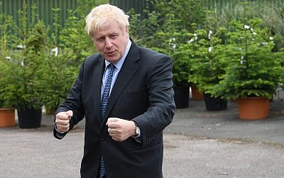 Conservative MP and leadership contender Boris Johnson gestures during a leadership campaign visit to a nursery in Braintree, southeast England, on July 13, 2019. (Neil Hall/Pool/AFP)