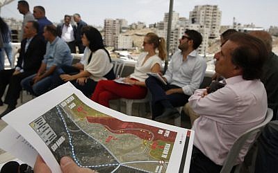 EU diplomats are given a tour of Palestinian buildings which have been issued notices to be demolished, in the village of Dar Salah near Beit Sahur in the West Bank south of Bethlehem on July 16, 2019. (HAZEM BADER / AFP)