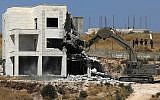 Israeli security forces razing one of the Palestinian buildings in the West Bank village of Dar Salah, adjacent to the Sur Baher area which straddles the West Bank and Jerusalem, July 22, 2019 shows. (Ahmad GHARABLI/AFP)