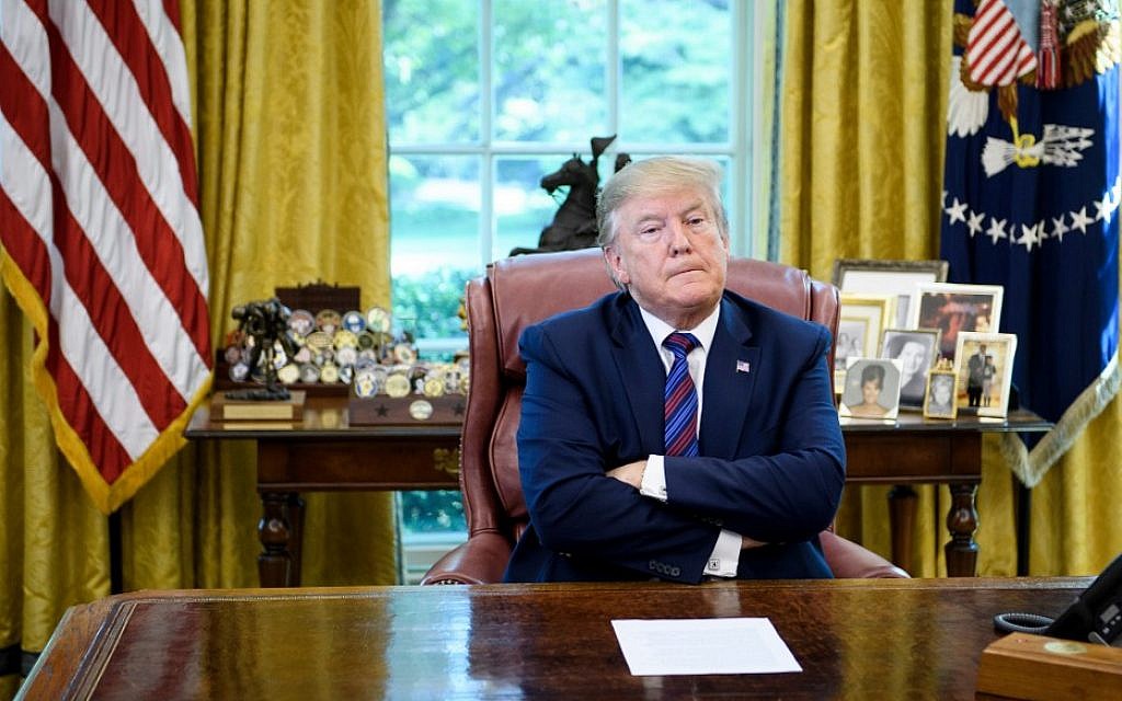 US President Donald Trump pauses while announcing an agreement with Guatemala regarding people seeking asylum in the Oval Office of the White House July 26, 2019, in Washington, DC. (Brendan Smialowski / AFP) US President Donald Trump pauses while announcing an agreement with Guatemala regarding people seeking asylum in the Oval Office of the White House July 26, 2019, in Washington, DC. (Brendan Smialowski / AFP)
