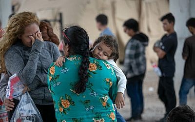 Immigrants wait to be interviewed by US Border Patrol agents after they were taken into custody on July 2, 2019 in McAllen, Texas. (John Moore/Getty Images/AFP)