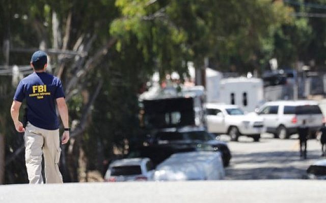 An FBI agent walks toward the site of the Gilroy Garlic Festival after a mass shooting there on July 29, 2019 in Gilroy, California. (Mario Tama/Getty Images/AFP) An FBI agent walks toward the site of the Gilroy Garlic Festival after a mass shooting there on July 29, 2019 in Gilroy, California. (Mario Tama/Getty Images/AFP)
