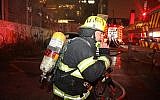 Firefighters battle a blaze at a building in Tel Aviv on Sunday July 7, 2019 (Fire Services)