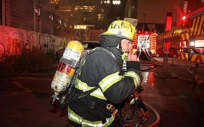 Firefighters battle a blaze at a building in Tel Aviv on Sunday July 7, 2019 (Fire Services)