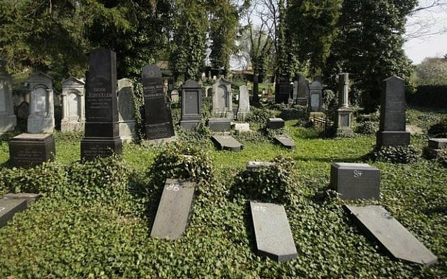 In this file picture taken on Wednesday, April 28, 2010, some of 92 tombstones that vandals knocked over sit on the ground of a Jewish cemetery in the village of Pristoupim, Czech Republic (AP Photo/Petr David Josek/File) In this file picture taken on Wednesday, April 28, 2010, some of 92 tombstones that vandals knocked over sit on the ground of a Jewish cemetery in the village of Pristoupim, Czech Republic (AP Photo/Petr David Josek/File)