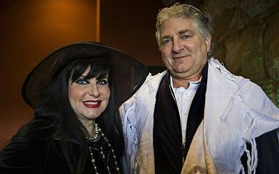 Simon and Jana Falic pose for a photo as they participate in the priestly blessing at the Western Wall, the holiest site where Jews can pray in Jerusalem's Old City, during the Jewish holiday of Passover, on April 22, 2019. (AP Photo/Tsafrir Abayov)