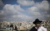 In this photo from March 6, 2019, a Jewish man visits the Israeli controlled part of the West Bank city of Hebron. (AP Photo/Ariel Schalit)
