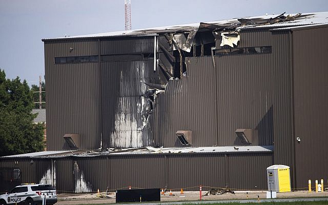 Damage is seen to a hangar after a twin-engine plane crashed into the building at Addison Airport in Addison, Texas, Sunday, June 30, 2019. The small airplane crashed as it was taking off from the Dallas-area airport Sunday morning, a spokeswoman for the town of Addison, Texas, said. (Shaban Athuman/The Dallas Morning News via AP) Damage is seen to a hangar after a twin-engine plane crashed into the building at Addison Airport in Addison, Texas, Sunday, June 30, 2019. The small airplane crashed as it was taking off from the Dallas-area airport Sunday morning, a spokeswoman for the town of Addison, Texas, said. (Shaban Athuman/The Dallas Morning News via AP)