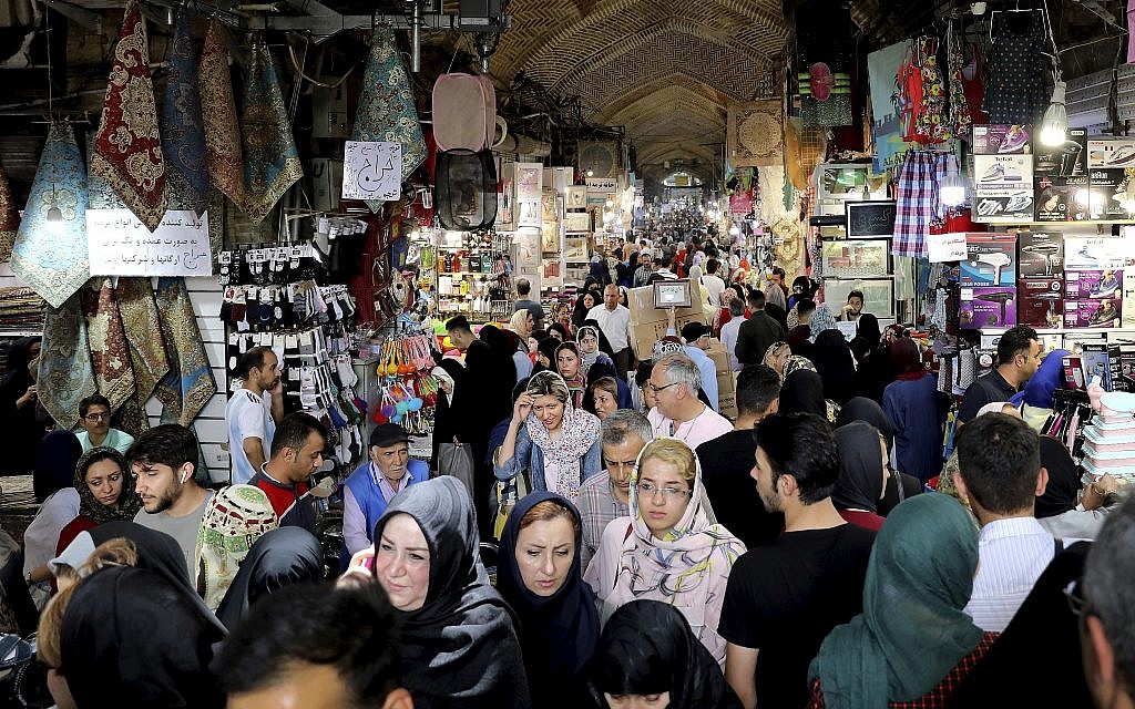 People shopping at the old main bazaar in Tehran, Iran, July 2, 2019. (AP Photo/Ebrahim Noroozi)