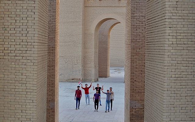 People celebrate at the archaeological site of Babylon, Iraq, Friday, July 5, 2019. Iraq on Friday celebrated the UNESCO World Heritage Committee's decision to name the historic city of Babylon a World Heritage Site in a vote held in Azerbaijan's capital, years after Baghdad began campaigning for the site to be added to the list. (AP Photo/Anmar Khalil) People celebrate at the archaeological site of Babylon, Iraq, Friday, July 5, 2019. Iraq on Friday celebrated the UNESCO World Heritage Committee's decision to name the historic city of Babylon a World Heritage Site in a vote held in Azerbaijan's capital, years after Baghdad began campaigning for the site to be added to the list. (AP Photo/Anmar Khalil)