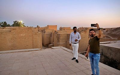 People visit the archaeological site of Babylon, Iraq, Friday, July 5, 2019. (AP Photo/Anmar Khalil)