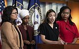 US Rep. Alexandria Ocasio-Cortez speaks as, from left, Reps. Rashida Tlaib, Ilhan Omar and Ayanna Pressley listen during a news conference at the Capitol in Washington, July 15, 2019. (AP Photo/J. Scott Applewhite)