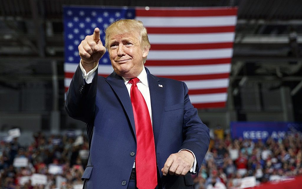 US President Donald Trump gestures to the crowd as he arrives to speak at a campaign rally at Williams Arena in Greenville, North Carolina, July 17, 2019. (Carolyn Kaster/AP) US President Donald Trump gestures to the crowd as he arrives to speak at a campaign rally at Williams Arena in Greenville, North Carolina, July 17, 2019. (Carolyn Kaster/AP)