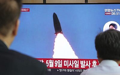 People watch a TV showing North Korea's missile launch, at the Seoul Railway Station in Seoul, South Korea, July 25, 2019. (AP Photo/Ahn Young-joon)
