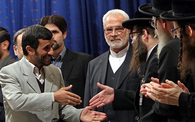 Iranian President Mahmoud Ahmadinejad, left, shakes hands with anti-Zionism Rabbi Yisroel Dovid Weiss, of Monsey, N.Y., at the start of a conference on the Holocaust, in Tehran, Dec. 12, 2006. Ahmadinejad initiated the two-day gathering. (AP Photo/Hasan Sarbakhshian)