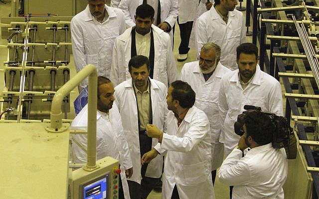 Iranian President Mahmoud Ahmadinejad, bottom second left, visits Iran's Fuel Manufacturing Plant (FMP), a new facility producing uranium fuel for a heavy-water nuclear reactor, just outside the city of Isfahan 255 mile (410 kilometers) south of the capital Tehran, Iran, Thursday, April 9, 2009. (AP Photo/Vahid Salemi)