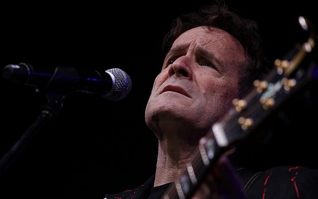 In this photo taken on Nov. 11, 2017, musician Johnny Clegg on stage at a farewell concert in Johannesburg (AP Photo/Denis Farrell) In this photo taken on Nov. 11, 2017, musician Johnny Clegg on stage at a farewell concert in Johannesburg (AP Photo/Denis Farrell)