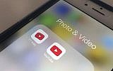 In this April 25, 2018, file photo the YouTube app and YouTube Kids app are displayed on an iPhone in New York. (AP Photo/Jenny Kane, File)