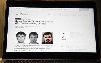 This Thursday, Sept. 27, 2018 file photo shows the website for British investigative group Bellingcat with one of the two suspects in the March poisoning of Sergei Skripal and his daughter in England. (AP/Alexander Zemlianichenko)