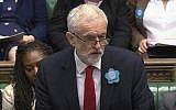 Britain's main opposition Labour Party leader Jeremy Corbyn wears a "Free Nazanin" badge as he speaks during Prime Minister's Questions session at the House of Commons in London, June 26, 2019.  (House of Commons TV / PA via AP)