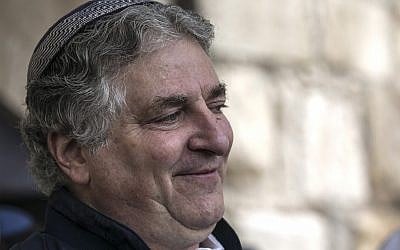 American businessman Simon Falic attends the priestly blessing, during the Jewish holiday of Passover, at the Western Wall, in Jerusalem's Old City, April 22, 2019. (AP Photo/Tsafrir Abayov)
