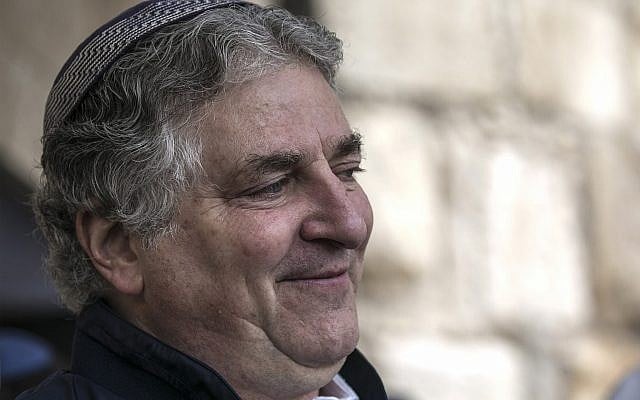 American businessman Simon Falic attends the priestly blessing, during the Jewish holiday of Passover, at the Western Wall, in Jerusalem's Old City, April 22, 2019. (AP Photo/Tsafrir Abayov) American businessman Simon Falic attends the priestly blessing, during the Jewish holiday of Passover, at the Western Wall, in Jerusalem's Old City, April 22, 2019. (AP Photo/Tsafrir Abayov)