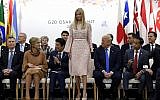 Ivanka Trump stands up to speak at the President G-20 summit event on women's empowerment in Osaka, Japan, in Osaka, Japan, Saturday, June 29, 2019. US President Donald Trump, center right, also attends. (AP Photo/Susan Walsh)