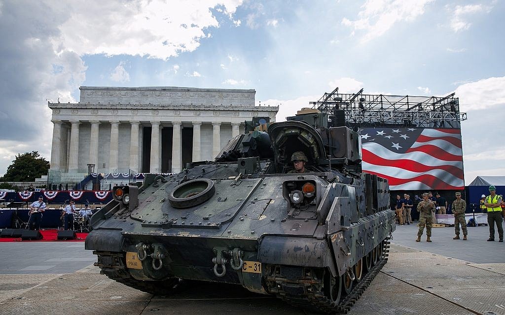 A US Army driver moves a Bradley Fighting Vehicle into place by the Lincoln Memorial in Washington, DC, ahead of planned Fourth of July festivities with President Donald Trump, on July 3, 2019. (AP Photo/Jacquelyn Martin)