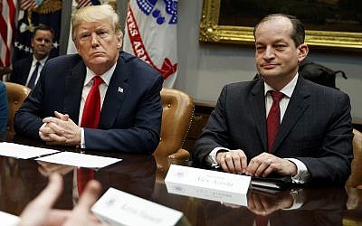 FILE - In this Sept. 17, 2018, file photo, US President Donald Trump, left, and Labor Secretary Alexander Acosta (R) listen during a meeting of the President's National Council of the American Worker in the Roosevelt Room of the White House in Washington (AP Photo/Evan Vucci, File)
