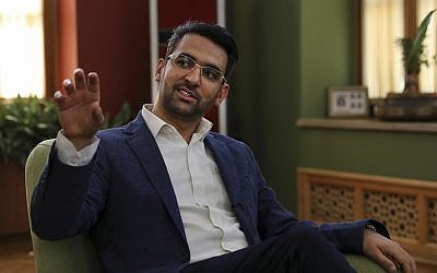 In this July 7, 2019 photo, Iran's telecommunications Minister Mohammad Javad Azari Jahromi is interviewed by The Associated Press at his office in Tehran, Iran (AP Photo/Vahid Salemi)
