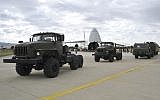 Military vehicles and equipment, parts of the S-400 defense systems, are seen on the tarmac, after they were unloaded from a Russian transport aircraft, at Murted military airport in Ankara, Turkey, Friday, July 12, 2019.  (Turkish Defence Ministry via AP, Pool)